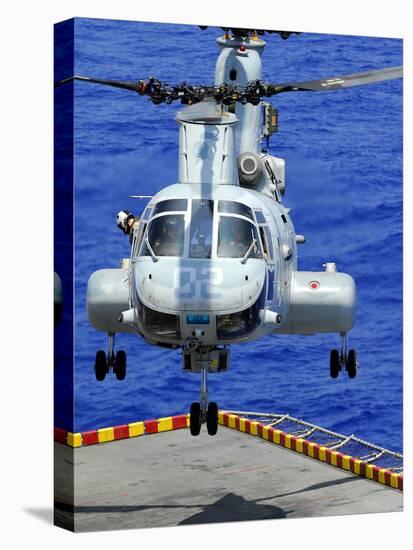 A CH-46E Sea Knight Helicopter Prepares To Land On the Flight Deck of USS Peleliu-Stocktrek Images-Stretched Canvas