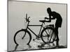 A Chadian Man Washes His Bicycle-null-Mounted Premium Photographic Print