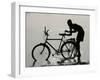 A Chadian Man Washes His Bicycle-null-Framed Photographic Print