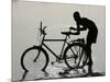 A Chadian Man Washes His Bicycle-null-Mounted Photographic Print