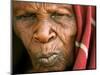 A Chadian Woman Made Homeless by Warfare Sits Near Her Hut-null-Mounted Photographic Print