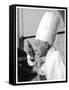 A Chef in a Chef's Hat Tastes Some Soup or Other Food from a Ladle-null-Framed Stretched Canvas