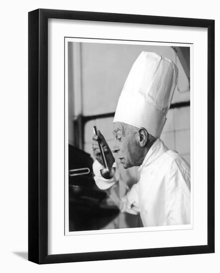 A Chef in a Chef's Hat Tastes Some Soup or Other Food from a Ladle-null-Framed Photographic Print