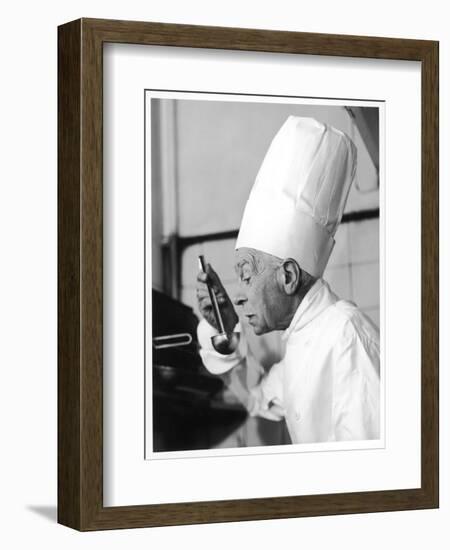 A Chef in a Chef's Hat Tastes Some Soup or Other Food from a Ladle-null-Framed Photographic Print