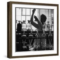 A Chemist at Work in Her Laboratory-Henry Grant-Framed Photographic Print