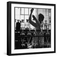 A Chemist at Work in Her Laboratory-Henry Grant-Framed Photographic Print