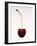 A Cherry Against a White Background-null-Framed Photographic Print