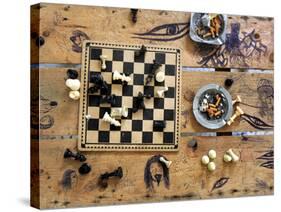 A Chess Board and Unemptied Ashtrays-null-Stretched Canvas