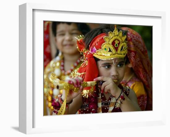 A Child Enacts the Life of Hindu God Krishna During Janamashtami Celebrations-null-Framed Premium Photographic Print