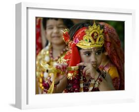 A Child Enacts the Life of Hindu God Krishna During Janamashtami Celebrations-null-Framed Premium Photographic Print