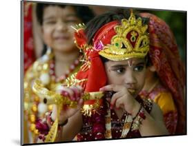 A Child Enacts the Life of Hindu God Krishna During Janamashtami Celebrations-null-Mounted Photographic Print