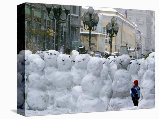 A Child Plays Among the Snowmen Made at the Arbat-null-Stretched Canvas