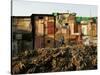 A Child Runs by a Row of Shacks in Novo Mundo Shantytown, Sao Paulo, Brazil-null-Stretched Canvas