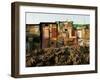 A Child Runs by a Row of Shacks in Novo Mundo Shantytown, Sao Paulo, Brazil-null-Framed Photographic Print