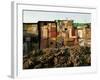 A Child Runs by a Row of Shacks in Novo Mundo Shantytown, Sao Paulo, Brazil-null-Framed Photographic Print