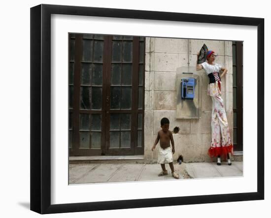 A Child Walks Past a Dancer of Giganteria's Group-null-Framed Photographic Print