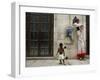 A Child Walks Past a Dancer of Giganteria's Group-null-Framed Photographic Print