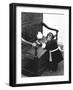 A Chimpanzee brushing up on the housework-Staff-Framed Photographic Print