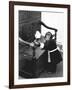 A Chimpanzee brushing up on the housework-Staff-Framed Photographic Print