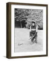 A Chimpanzee playing a round of golf-Staff-Framed Premium Photographic Print