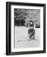 A Chimpanzee playing a round of golf-Staff-Framed Photographic Print