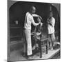 A Chinese Barber at Bhamo, Burma, 1908-null-Mounted Photographic Print