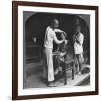 A Chinese Barber at Bhamo, Burma, 1908-null-Framed Photographic Print