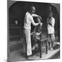 A Chinese Barber at Bhamo, Burma, 1908-null-Mounted Photographic Print