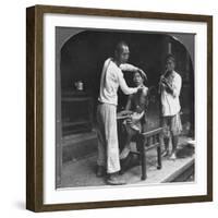 A Chinese Barber at Bhamo, Burma, 1908-null-Framed Photographic Print