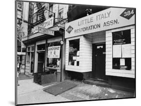 A Chinese Laundromat is Seen Next Door to the Offices of the Little Italy Restoration Association-null-Mounted Photographic Print