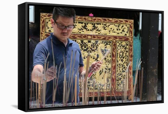 A Chinese man praying and offering incense, Thian Hock Keng Temple, Singapore-Godong-Framed Stretched Canvas