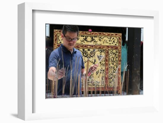 A Chinese man praying and offering incense, Thian Hock Keng Temple, Singapore-Godong-Framed Photographic Print