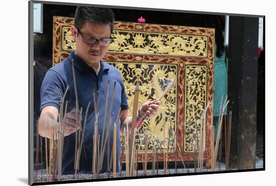 A Chinese man praying and offering incense, Thian Hock Keng Temple, Singapore-Godong-Mounted Photographic Print