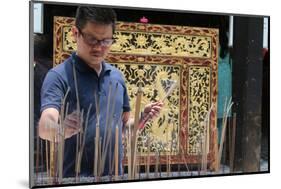 A Chinese man praying and offering incense, Thian Hock Keng Temple, Singapore-Godong-Mounted Photographic Print