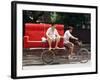 A Chinese Man Rides on a Sofa as Another Pedals a Delivery Tricycle-null-Framed Photographic Print