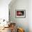 A Chinese Man Rides on a Sofa as Another Pedals a Delivery Tricycle-null-Framed Photographic Print displayed on a wall