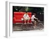 A Chinese Man Rides on a Sofa as Another Pedals a Delivery Tricycle-null-Framed Photographic Print