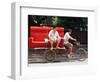A Chinese Man Rides on a Sofa as Another Pedals a Delivery Tricycle-null-Framed Photographic Print