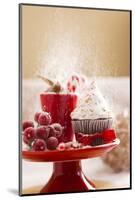 A Christmas Cupcakes in an Icing Sugar Snowstorm-Rogério Voltan-Mounted Photographic Print