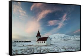 A church in the winter in western Iceland at sunset.-Alex Saberi-Framed Stretched Canvas