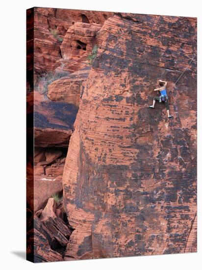 A Climber Ascends a Rock Face-null-Stretched Canvas