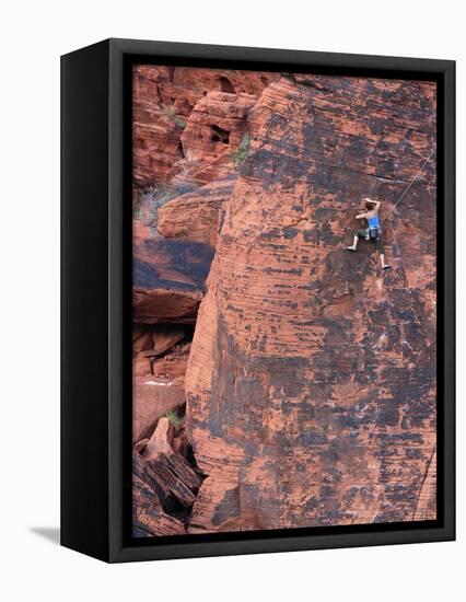 A Climber Ascends a Rock Face-null-Framed Stretched Canvas