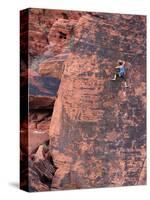 A Climber Ascends a Rock Face-null-Stretched Canvas