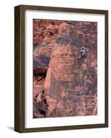 A Climber Ascends a Rock Face-null-Framed Photographic Print