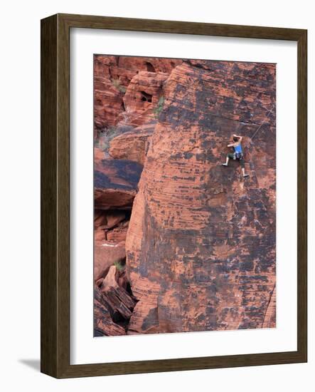 A Climber Ascends a Rock Face-null-Framed Photographic Print