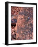 A Climber Ascends a Rock Face-null-Framed Photographic Print