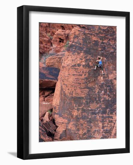 A Climber Ascends a Rock Face-null-Framed Photographic Print