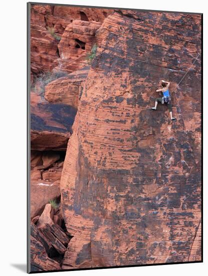 A Climber Ascends a Rock Face-null-Mounted Photographic Print