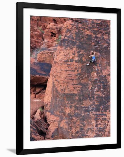 A Climber Ascends a Rock Face-null-Framed Photographic Print