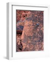 A Climber Ascends a Rock Face-null-Framed Photographic Print